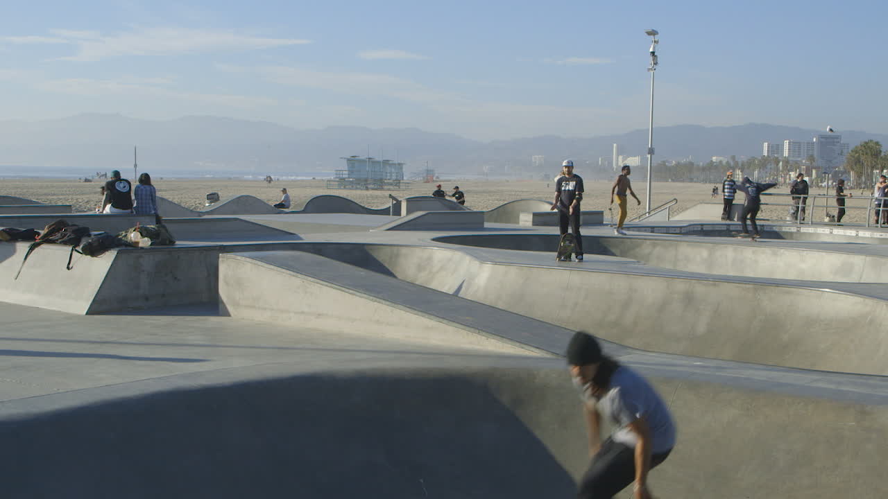 Skaters Enjoying a Sunny Day at Venice Beach Skatepark, California