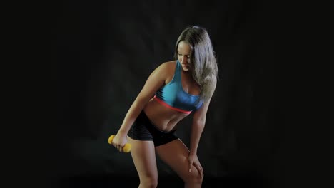 woman working out with dumbbells