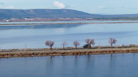 van exploring the beautiful lakes in the french countryside along a highway