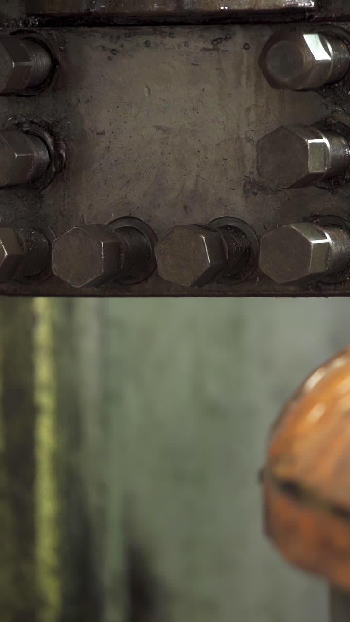 Close-up of Industrial Bolts on Metal Machinery