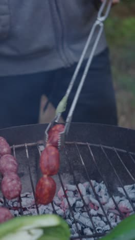 grilling sausages and chorizo on a charcoal bbq
