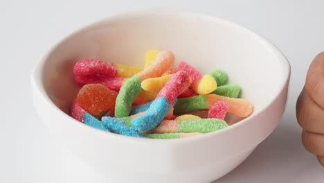 colorful gummy worms in a bowl