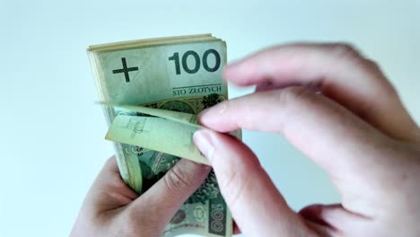 close-up young man hands counting money