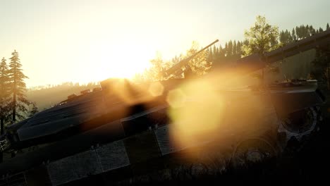 old rusty tank in the forest at sunset