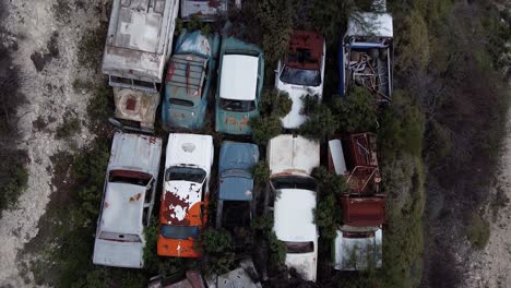 Close-aerial-view-of-old-antique-cars-in-a-junkyard