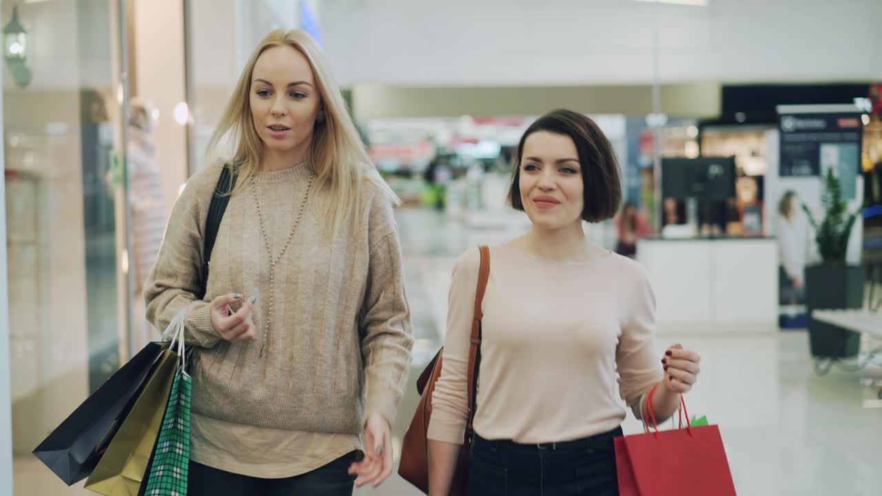 Two women shopping in a mall