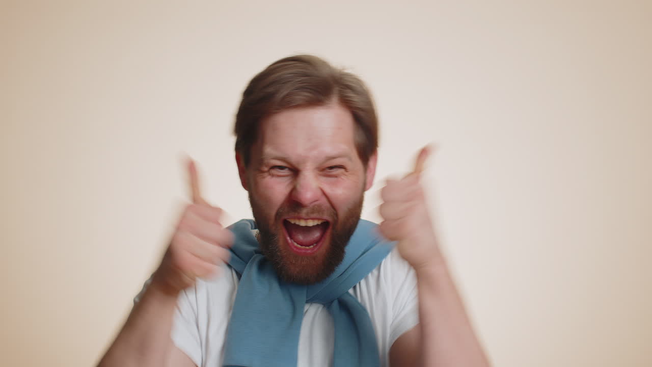 Happy young man celebrating success winning birthday lottery jackpot goal achievemen good news