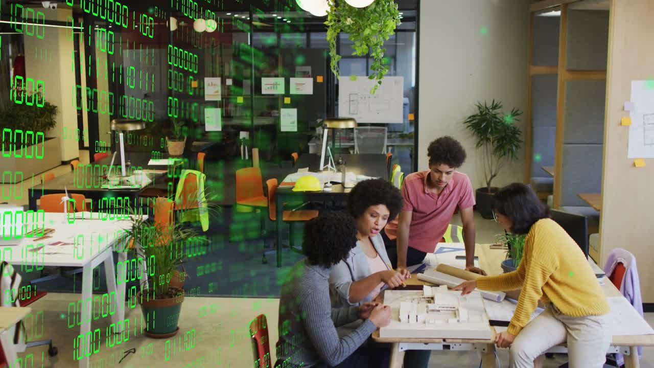 Designers passing plans, building model for layout check, green overlay reflecting numbers on glass