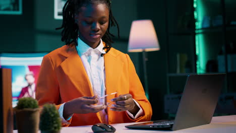 Portrait of young woman resolving school tasks on laptop