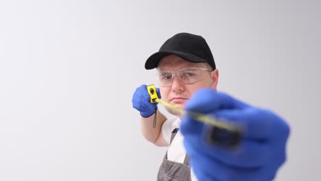man measuring with tape measure