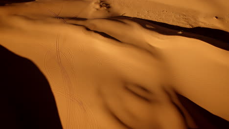 high-altitude view looking down on the sculptural beauty of the pink sand dunes state park.