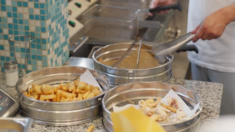 freshly fried food being served at a fast food restaurant in genoa, italy