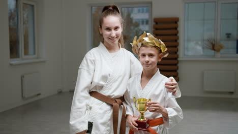 pupil and teacher in white kimono in martial arts class