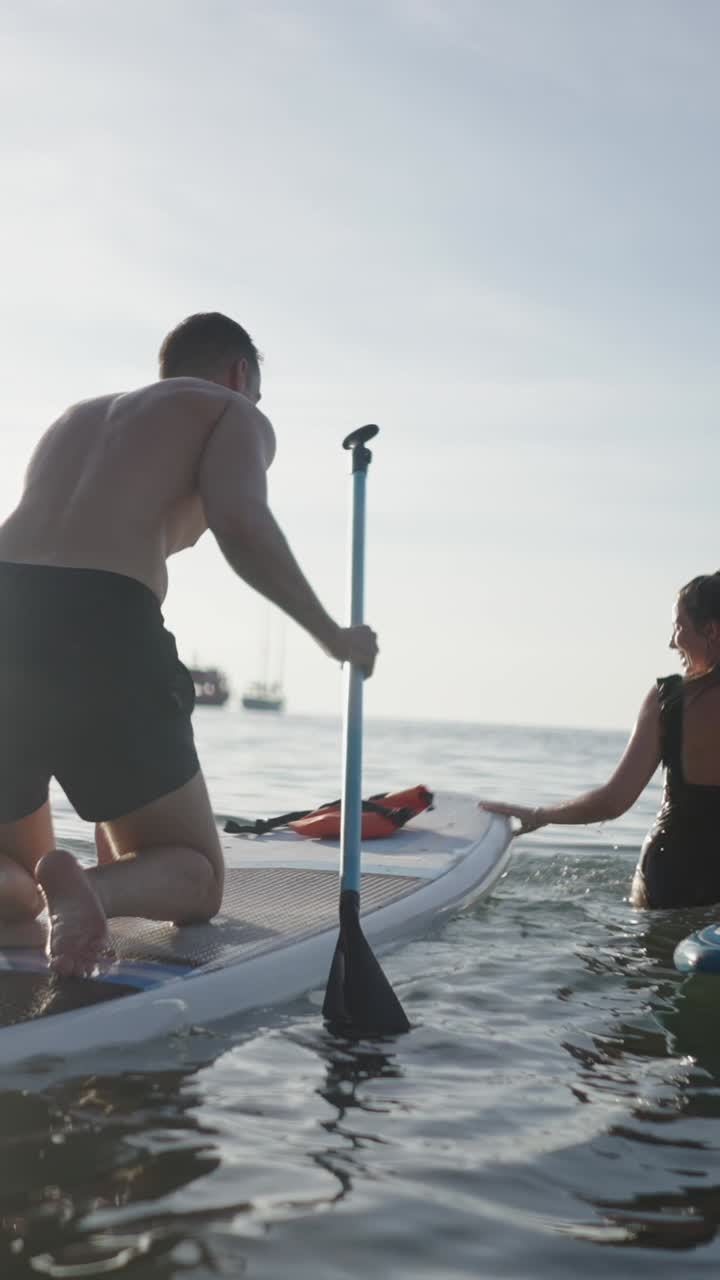 People paddleboarding in the sea
