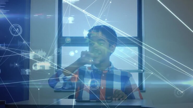 Animation of networks of connections with icons over schoolboy using computer
