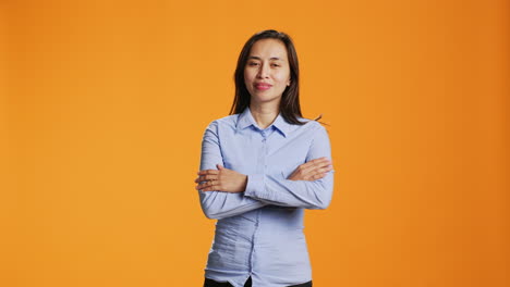 portrait of cheerful person standing in arms crossed