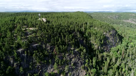 A-cross-of-god-is-placed-on-the-top-of-a-rocky-cliff