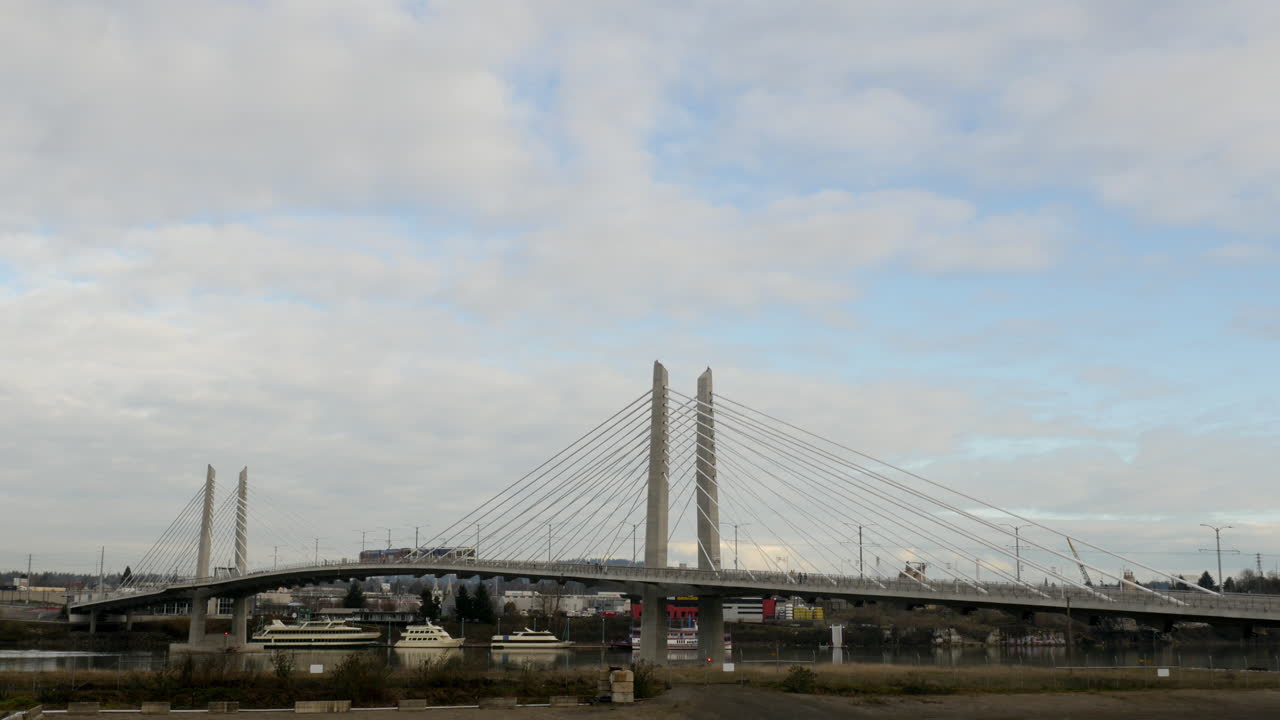 Tilikum Bridge Crossing with trams and buses in Portland Oregon USA in 4k High Resolution