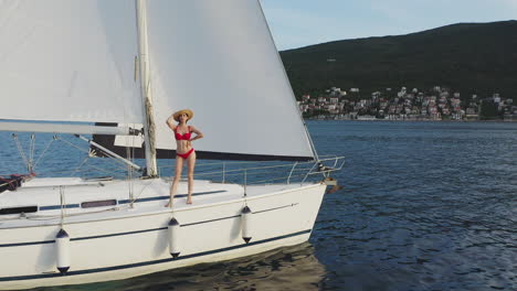 woman in red bikini on a sailing yacht