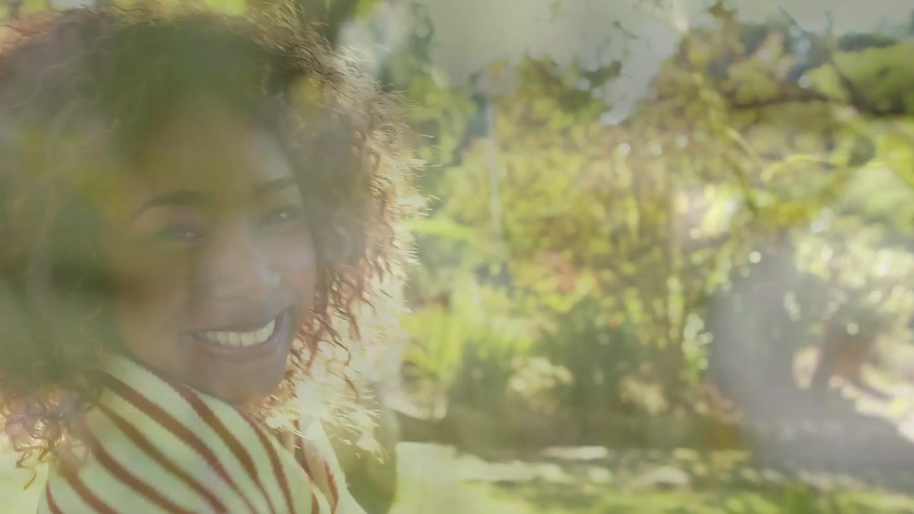 Woman spotting offscreen view, pointing while camera pulling back, floral overlay showing lifestyle