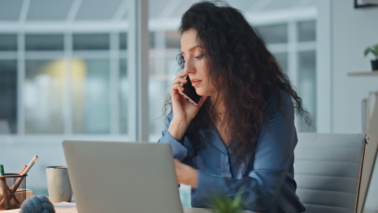 Manager discussing problem call in evening. Closeup serious professional working