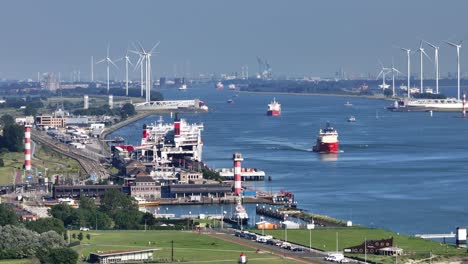 canal port with wind turbines and ships