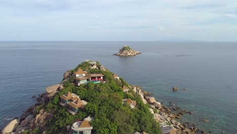 aerial view of a tropical island with a boat in the water