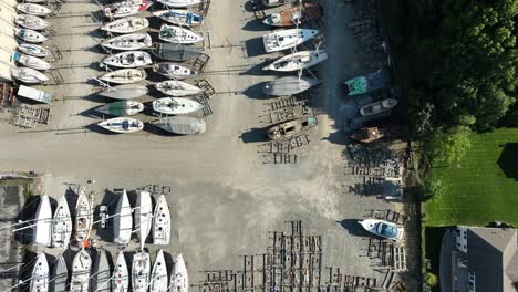 direct aerial over some sailboats lined up for repair