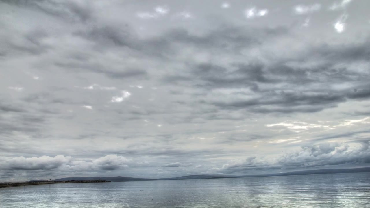 HDR Timelapse of clouds moving over water.