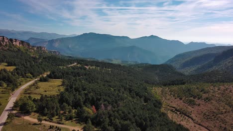 road and landscape in mountains reveals country house near figols
