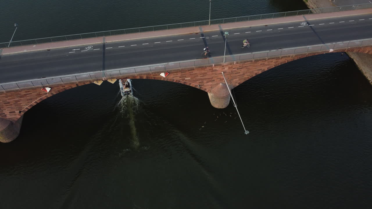 River Bridge with Boat and Cyclists