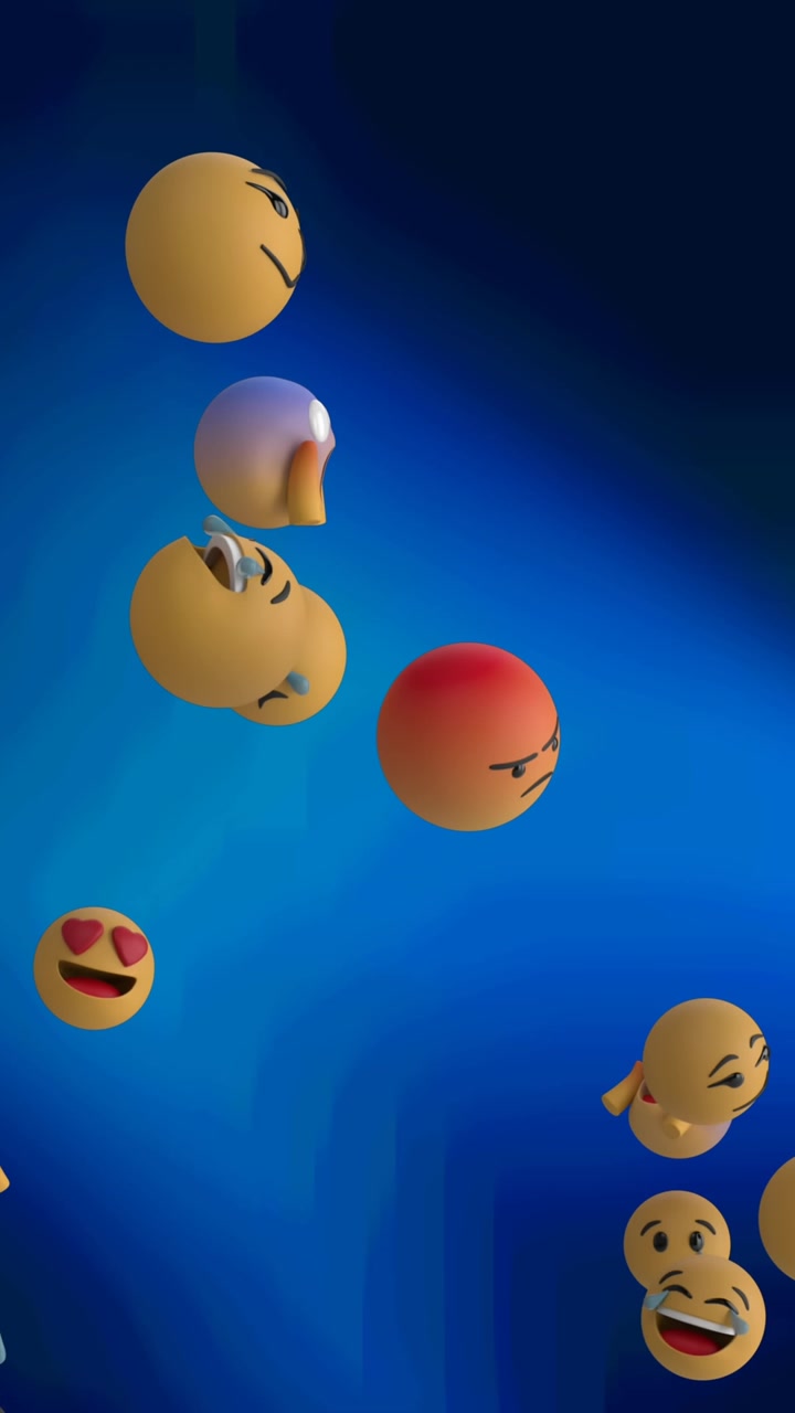 Digitální animace několika obličejových emoji vznášejících se na pozadí modrých světelných bodů na černém pozadí.