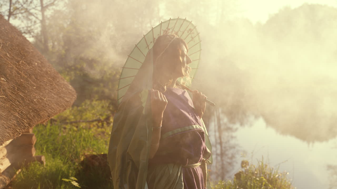 Woman in Traditional Outfit with Parasol