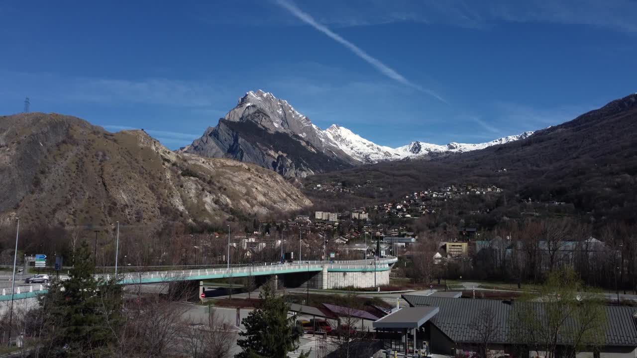Scenic Mountain Landscape with Bridge and Town
