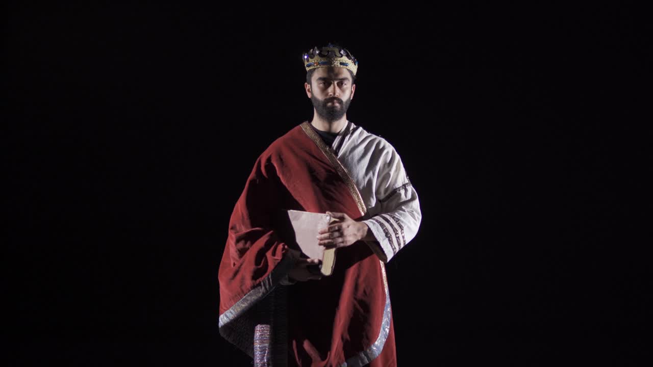 Roman Emperor. Historical reenactment. Black background.