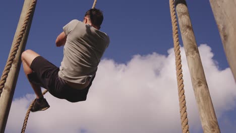 young man training at an outdoor gym bootcamp