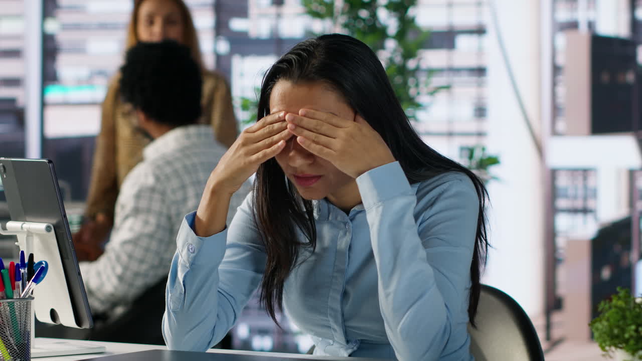 Businesswoman working in office on laptop