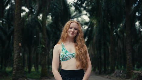 Woman in bikini top in a forest
