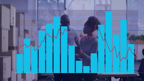 bar and line graph animation over diverse business people discussing in office