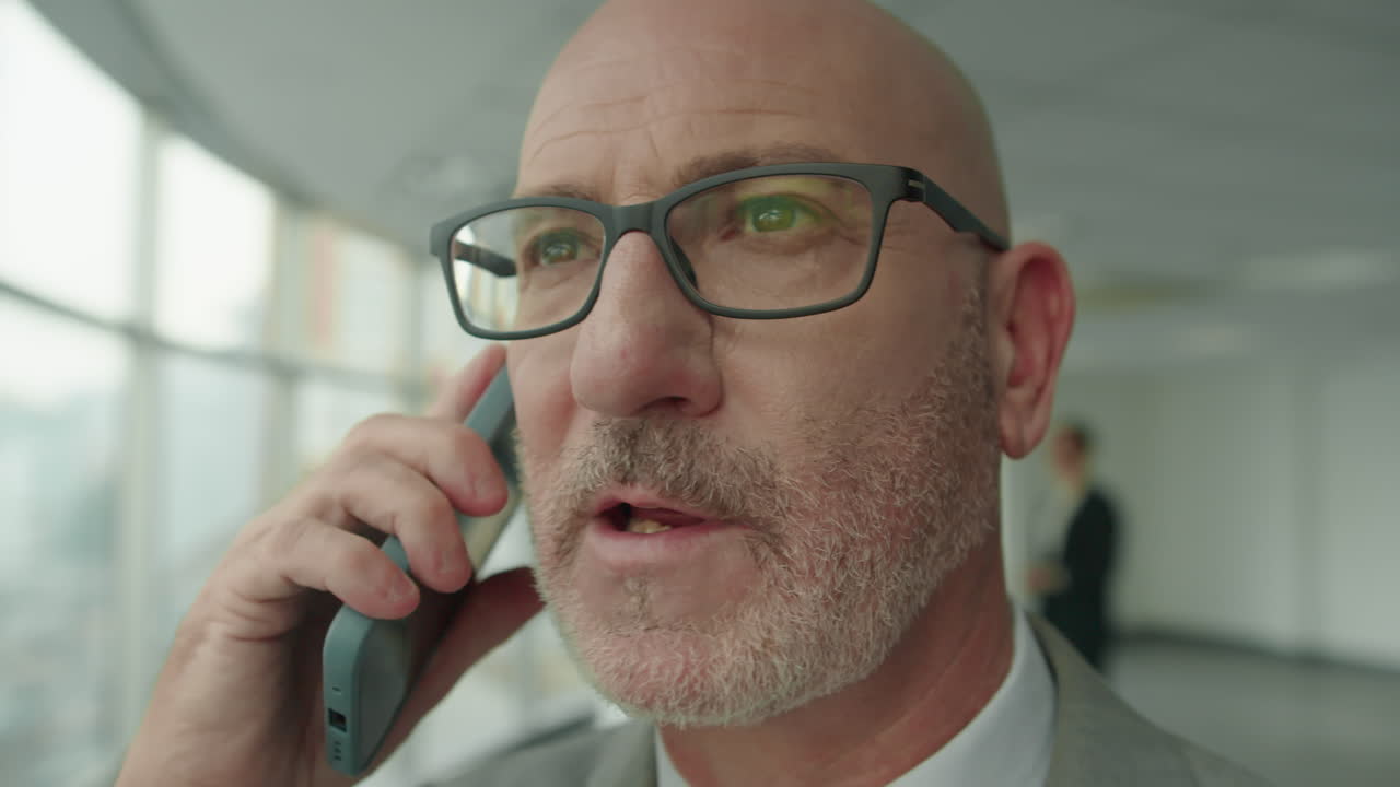 CEO Calling Business Partner on Mobile Phone Close Up