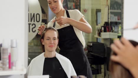 Hairdressers-trimming-their-client-hair