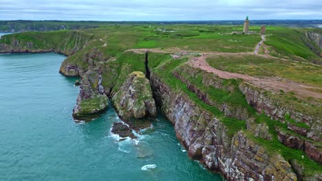 wonderful drone view of cap fréhel peninsula with calm waters on beautiful cliffside and rock formations, côtes-d'armor, brittany, france.