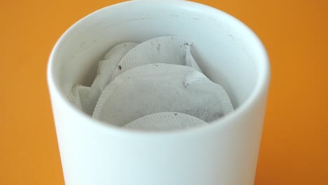 close-up of tea bags in a white mug