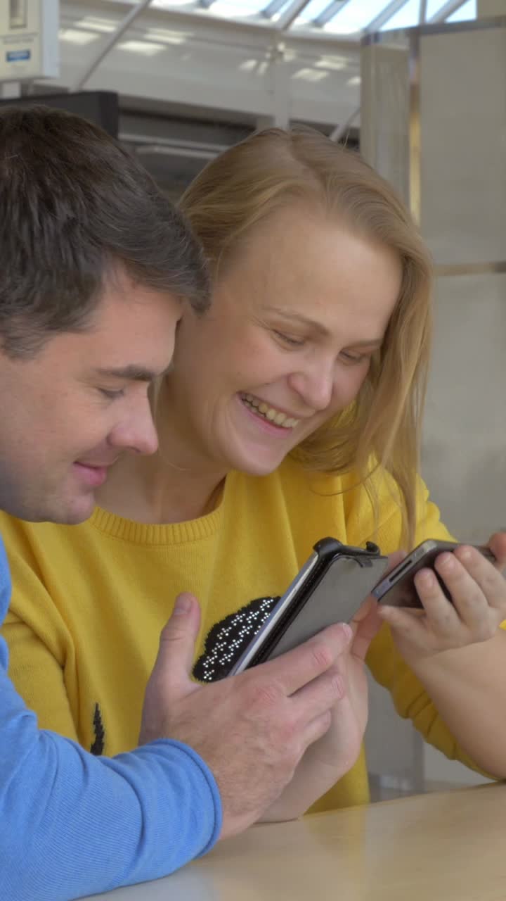 Couple looking at smartphones