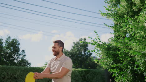 Smiling-woman-throwing-flying-disc-on-backyard