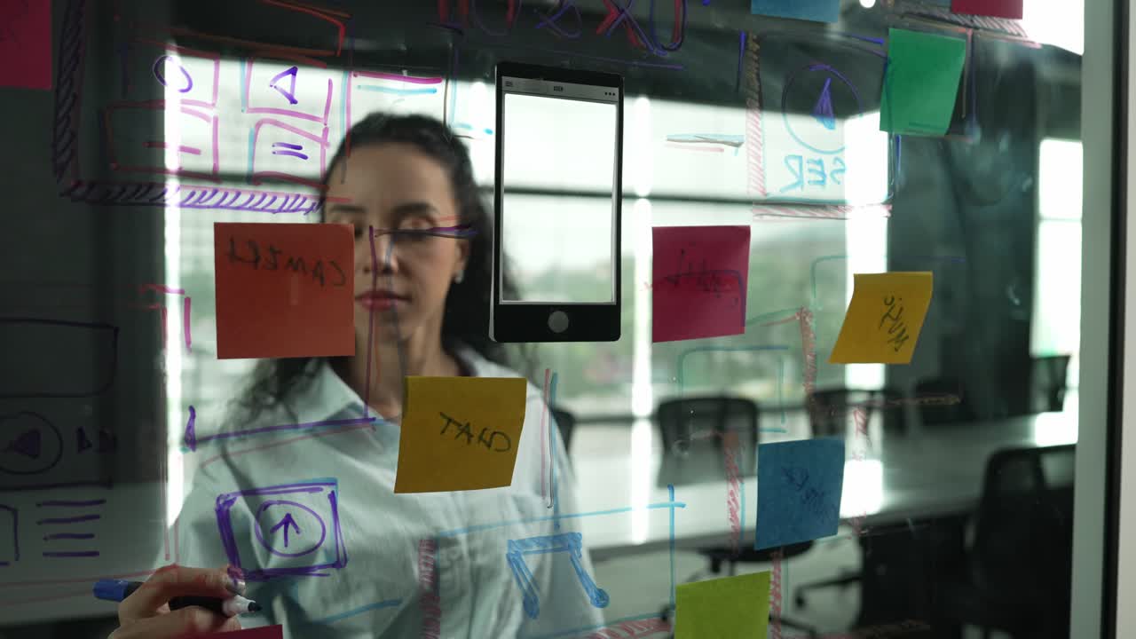 Young hispanic employee writing on colorful sticky notes. Closeup. Manipulator.