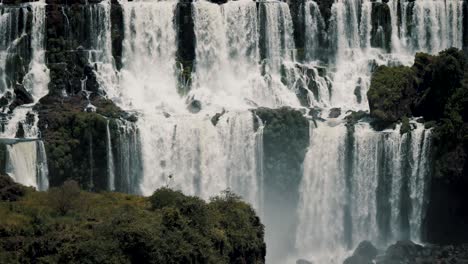 iguazu falls with staircase character flowing down the river in brazil