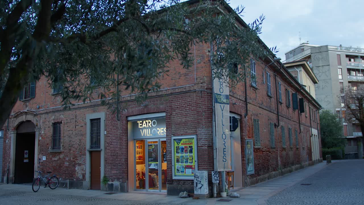 Slow-motion of Monza’s Teatro Villoresi on a cold autumn night, revealing its theatre.