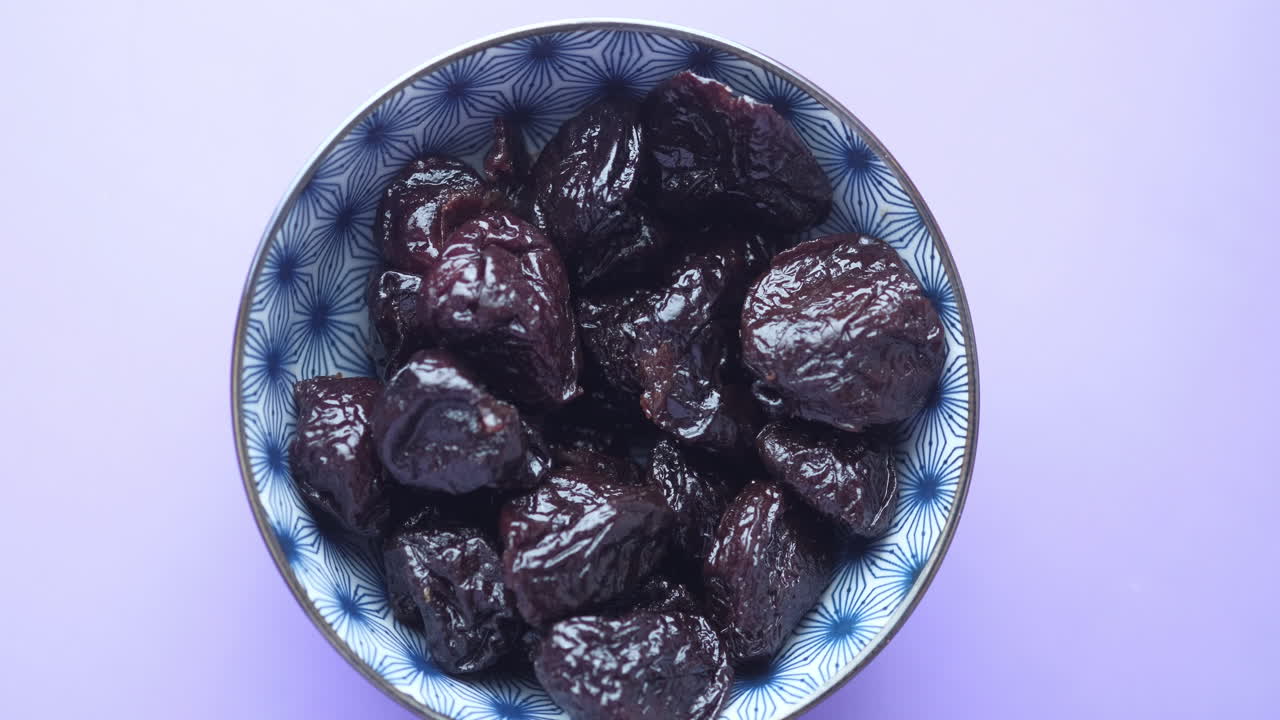 Dried Plums in a Bowl