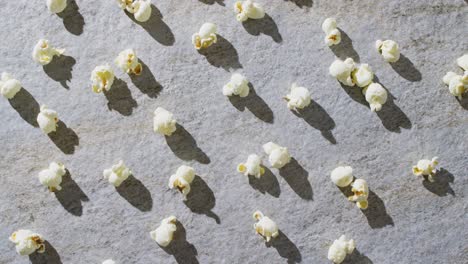 video of close up of popcorn on gray background